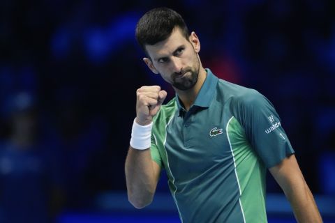 Serbia's Novak Djokovic reacts during his singles semifinal tennis match against Spain's Carlos Alcaraz of the ATP World Tour Finals at the Pala Alpitour, in Turin, Italy, Saturday, Nov. 18, 2023. (AP Photo/Antonio Calanni)