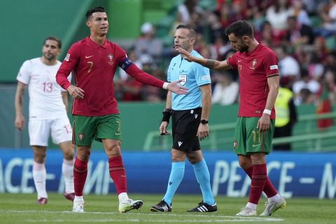 Portugal's Cristiano Ronaldo and Portugal's Bruno Fernandes during the UEFA Nations League soccer match between Portugal and Switzerland, at the Jose Alvalade Stadium in Lisbon, Portugal, Sunday, June 5, 2022. (AP Photo/Armando Franca)