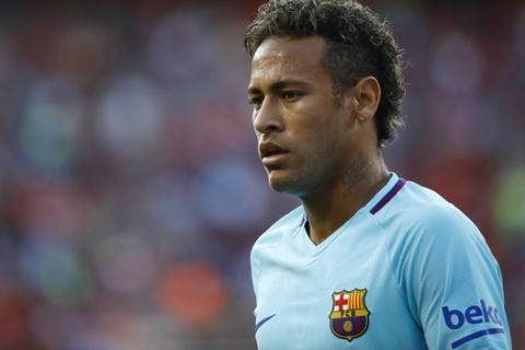 Barcelona's Neymar walks on the field during the first half of an International Champions Cup soccer match against Manchester United, Wednesday, July 26, 2017, in Landover, Md. (AP Photo/Patrick Semansky)