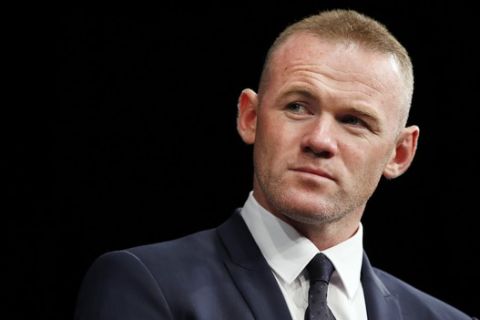 English soccer star Wayne Rooney, the all-time leading scorer for England's national team and Manchester United in the Premier League, listens during a news conference announcing his signing with MLS team D.C. United, Monday, July 2, 2018, at the Newseum in Washington. (AP Photo/Jacquelyn Martin)