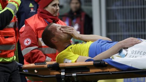 Sweden's Ludwig Augustinsson is carried off the pitch after sustaining an injury during the World Cup qualifying play-off second leg soccer match between Italy and Sweden, at the Milan San Siro stadium, Italy, Monday, Nov. 13, 2017. (AP Photo/Luca Bruno)