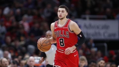 Chicago Bulls guard Zach LaVine brings the ball up court against the Golden State Warriors during the second half of an NBA basketball game, Monday, Oct. 29, 2018, in Chicago. (AP Photo/Kamil Krzaczynski)
