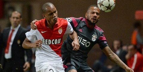 Monaco's Brazilian defender Fabio Tavares (L) and Benfica's Brazilian player Tiago vie for the ballduring the UEFA Champions League Group C football match Monaco (ASM) vs Benfica (SLB) at the Louis II Stadium in Monaco on October 22, 2014. AFP PHOTO / BORIS HORVAT        (Photo credit should read BORIS HORVAT/AFP/Getty Images)