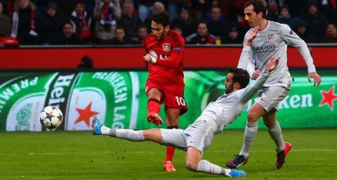 LEVERKUSEN, GERMANY - FEBRUARY 25:  Hakan Calhanoglu of Bayer Leverkusen scores the opening goal during the UEFA Champions League round of 16 match between Bayer 04 Leverkusen and Club Atletico de Madrid at BayArena on February 25, 2015 in Leverkusen, Germany.  (Photo by Alex Grimm/Bongarts/Getty Images)