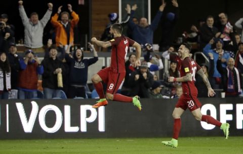 United States' Clint Dempsey, center, celebrates his free-kick goal with teammate Geoff Cameron, right, during the second half of a World Cup qualifying soccer match against Honduras on Friday, March 24, 2017, in San Jose, Calif. (AP Photo/Marcio Jose Sanchez)