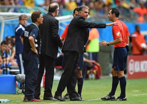 SALVADOR, BRAZIL - JUNE 25:  Head coach Carlos Queiroz of Iran speaks with referee Carlos Velasco Carballo during the 2014 FIFA World Cup Brazil Group F match between Bosnia and Herzegovina and Iran at Arena Fonte Nova on June 25, 2014 in Salvador, Brazil.  (Photo by Jamie McDonald/Getty Images)