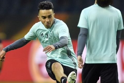 FILE - This is a Tuesday, May 23, 2017  file photo of Ajax's Abdelhak Nouri as he kicks a ball during a training session at the Friends Arena in Stockholm, Sweden. Ajax midfielder Abdelhak Nouri who collapsed due to an irregular heartbeat during a friendly game in Austria on Saturday July 8, 2017 has suffered "severe and permanent brain damage." The Dutch club says "it received very bad news regarding the condition of Abdelhak Nouri" after doctors at a hospital in Innsbruck woke up the player from an induced coma. (AP Photo/Martin Meissner/File)