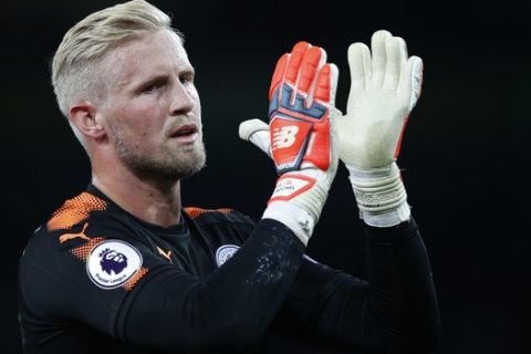 Leicester City's goalkeeper Kasper Schmeichel applauds his teams fans after the English Premier League soccer match between Arsenal and Leicester City at the Emirates stadium in London, Friday, Aug. 12, 2017. (AP Photo/Alastair Grant)