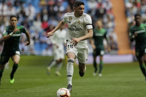 Real Madrid's Federico Valverde runs for the ball during a Spanish La Liga soccer match between Real Madrid and Betis at the Santiago Bernabeu stadium in Madrid, Spain, Sunday, May 19, 2019. (AP Photo/Bernat Armangue)