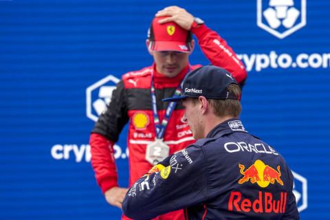 Red Bull driver Max Verstappen of the Netherlands , right, walks past Ferrari driver Charles Leclerc of Monaco after they clocked respectively the fastest and second time during sprint race at the Enzo and Dino Ferrari racetrack, in Imola, Italy, Saturday, April 23, 2022. The Italy's Emilia Romagna Formula One Grand Prix will be held on Sunday. (AP Photo/Luca Bruno)