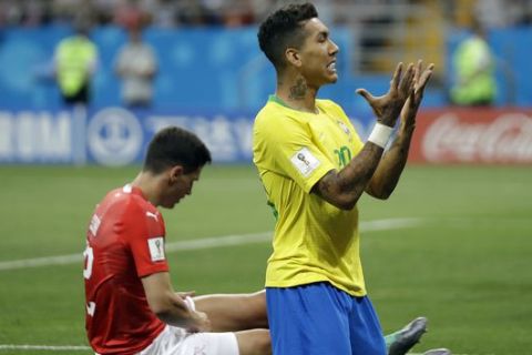 Brazil's Roberto Firmino gestures during the group E match between Brazil and Switzerland at the 2018 soccer World Cup in the Rostov Arena in Rostov-on-Don, Russia, Sunday, June 17, 2018. (AP Photo/Felipe Dana)