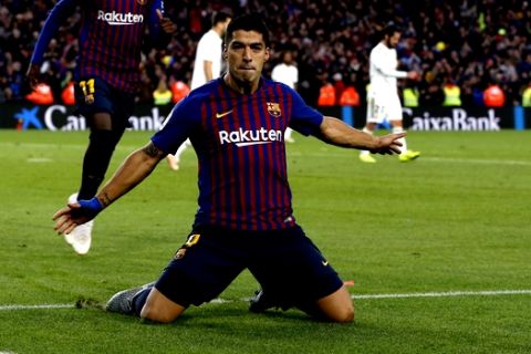 Barcelona forward Luis Suarez celebrates after scoring his side's third goal during the Spanish La Liga soccer match between FC Barcelona and Real Madrid at the Camp Nou stadium in Barcelona, Spain, Sunday, Oct. 28, 2018. (AP Photo/Joan Monfort)