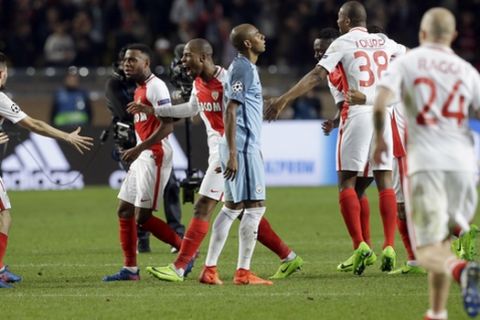 Manchester City's Fernandinho, center right, reacts while Monaco players celebrate their victory at the end of a Champions League round of 16 second leg soccer match between Monaco and Manchester City at the Louis II stadium in Monaco, Wednesday March 15, 2017. Midfielder Tiemoue Bakayoko's thumping header sent Monaco through to the Champions League quarterfinals as the home side beat Manchester City 3-1 on Wednesday to progress on the away goals rule in another pulsating match between two attack-minded sides. (AP Photo/Claude Paris)