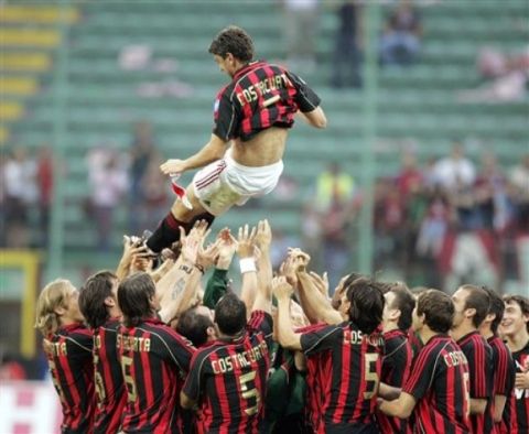 AC Milan defender Alessandro Costacurta is tossed in the air by his cheering teammates, all wearing a shirt with his name, at the end of an Italian major league soccer match against Udinese at the San Siro stadium  in Milan, Italy, Saturday, May 19, 2007. Costacurta, 41, announced his retirement after this match. (AP Photo/Luca Bruno)