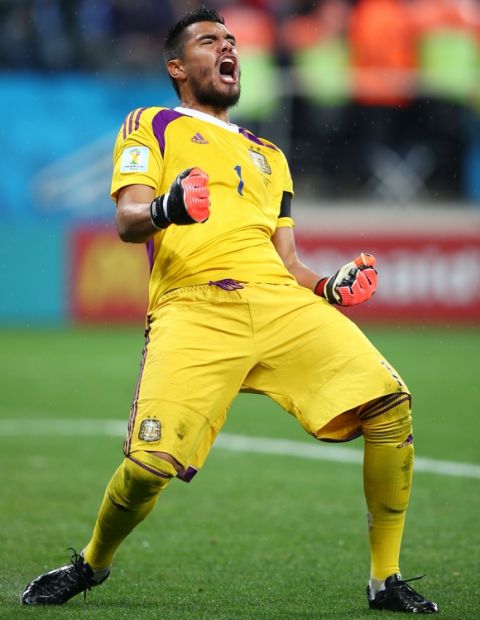 SAO PAULO, BRAZIL - JULY 09:  Sergio Romero of Argentina celebrates saving the penalty kick of Wesley Sneijder of the Netherlands (not pictured) in a shootout during the 2014 FIFA World Cup Brazil Semi Final match between the Netherlands and Argentina at Arena de Sao Paulo on July 9, 2014 in Sao Paulo, Brazil.  (Photo by Clive Rose/Getty Images)
