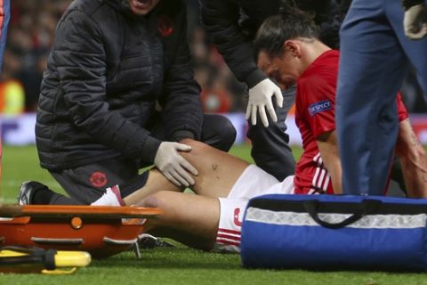 FILE - In this file photo dated Thursday, April 20, 2017, Manchester United's Zlatan Ibrahimovic is checked before being taken off with an injury during the Europa League quarterfinal second leg soccer match between Manchester United and Anderlecht at Old Trafford stadium, in Manchester, England.  Manchester United manager Jose Mourinho says Zlatan Ibrahimovic is in contention to play against Newcastle on upcoming Saturday after he sustained serious knee injuries in the Europa League match against Anderlecht. (AP Photo/Dave Thompson, FILE)