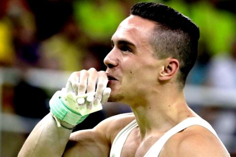 Greece's Eleftherios Petrounias celebrates after his performance on the rings during the artistic gymnastics men's apparatus final at the 2016 Summer Olympics in Rio de Janeiro, Brazil, Monday, Aug. 15, 2016. (AP Photo/Rebecca Blackwell) 