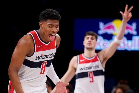 Washington Wizards forward Rui Hachimura (8) reacts after scoring three points in the second half of an NBA basketball game against the Brooklyn Nets, Thursday, Feb. 17, 2022, in New York. (AP Photo/John Minchillo)