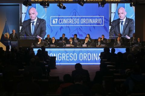 FIFA President Gianni Infantino delivers his speech during the 67 ordinary and extraordinary South American Football Confederation, CONMEBOL, congress in Santiago, Chile, Wednesday, April 26, 2017. (AP Photo/Esteban Felix)