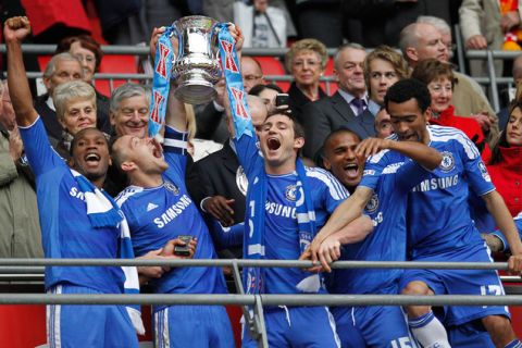 Chelsea's Ivorian striker Didier Drogba (L), captain John Terry (2nd L) and midfielder Frank Lampard (3rd L) lift the cup after Chelsea's 2-1 win in the FA Cup final football match between Liverpool and Chelsea at Wembley Stadium in London, England on May 5, 2012. AFP PHOTO/IAN KINGTON
                                                                                                             
NOT FOR MARKETING OR ADVERTISING USE / RESTRICTED TO EDITORIAL USEIAN KINGTON/AFP/GettyImages