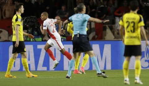 Monaco 's Kylian Mbappe, second left, runs after scoring his team opening goal during the Champions League quarterfinal second leg soccer match between Monaco and Dortmund at the Louis II stadium in Monaco, Wednesday April 19, 2017. (AP Photo/Claude Paris)