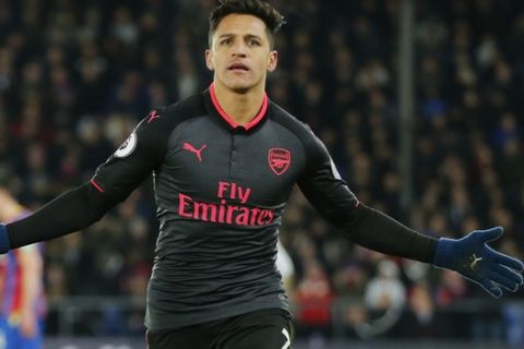 Arsenal's Alexis Sanchez celebrates after scoring his side's third goal of the game during their English Premier League soccer match between Crystal Palace and Arsenal at Selhurst Park stadium in London, Thursday, Dec. 28, 2017. (AP Photo/Alastair Grant)