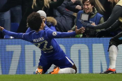 Chelsea's Willian celebrates scoring the opening goal during a Champions League round of sixteen first leg soccer match between FC Barcelona and Chelsea at Stamford Bridge stadium in London, Tuesday, Feb. 20, 2018. (AP Photo/Alastair Grant)