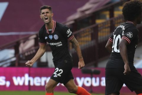 Chelsea's Christian Pulisic celebrates after scoring his side's opening goal during the English Premier League soccer match between Aston Villa and Chelsea at the Villa Park stadium in Birmingham, England, Sunday, June 21, 2020. (Molly Darlington/Pool via AP)