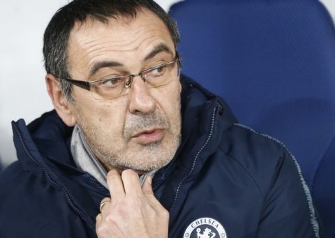 Chelsea manager Maurizio Sarri waits for the start of the Europa League round of 16, second leg soccer match between Dynamo Kiev and Chelsea at the Olympiyskiy stadium in Kiev, Ukraine, Thursday, March 14, 2019. (AP Photo/Efrem Lukatsky)
