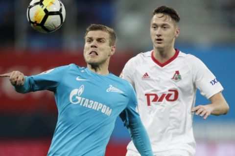 Zenit's Aleksandr Kokorin, left, fights for the ball with Lokomotiv's Anton Miranchuk during a Russia's Premier League soccer match between Zenit St. Petersburg and Lokomotiv Moscow in St. Petersburg, Russia, Sunday, Oct. 29, 2017. (AP Photo/Dmitri Lovetsky)