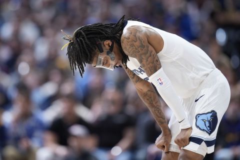 Memphis Grizzlies guard Ja Morant reacts as the team trails the Denver Nuggets during the second half of an NBA basketball game Friday, March 3, 2023, in Denver. (AP Photo/David Zalubowski)