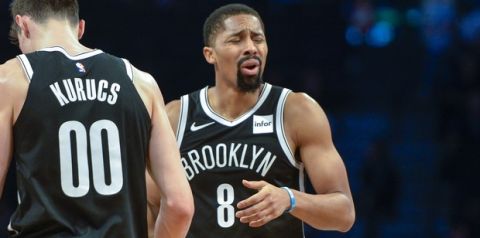 Brooklyn Nets guard Spencer Dinwiddie (8) reacts after foul call against Brooklyn Nets forward Rodions Kurucs (00) in the second half of an NBA basketball game against the Cleveland Cavaliers, Monday, Dec. 3, 2018, in New York. (AP Photo/Howard Simmons)