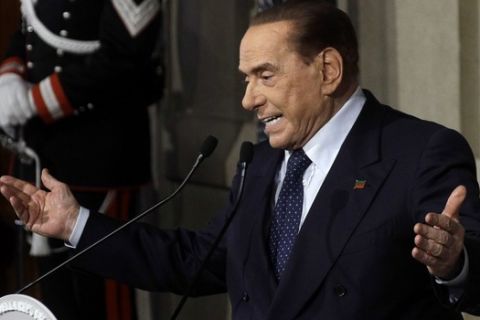 FILE - In this file photo dated Thursday, April 12, 2018, Forza Italia party's leader Silvio Berlusconi addresses journalists at the Quirinale presidential palace in Rome.  According to Milan daily newspaper Corriere della Sera reporting Saturday May 12, 2018, a court in Milan has ruled that 81-year old former premier Silvio Berlusconi can run for office again, 5-years after a tax fraud conviction. (AP Photo/Gregorio Borgia, FILE)