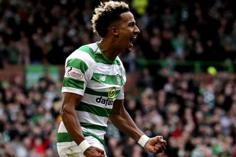 Celtic's Scott Sinclair celebrates scoring his side's first goal of the game against Motherwell, during their Scottish Premiership soccer match at Celtic Park in Glasgow, Scotland, Sunday Feb. 24, 2019. (Andrew Milligan/PA via AP)