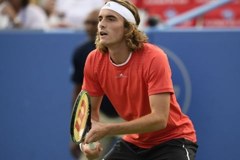 Stefanos Tsitsipas, of Greece, stands on the court during a match against Benoit Paire, of France, in the Citi Open tennis tournament, Friday, Aug. 2, 2019, in Washington. (AP Photo/Nick Wass)