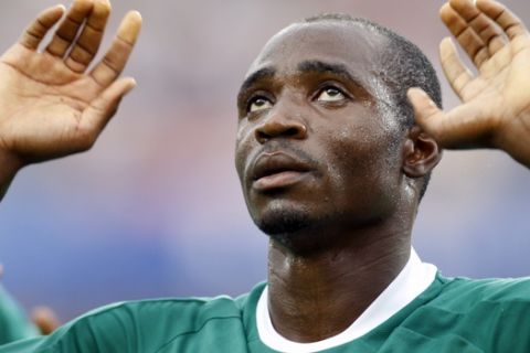 Nigeria's Promise Isaac celebrates after scoring against USA during their Group B men soccer match at the Beijing 2008 Olympics in Beijing, Wednesday, Aug.13, 2008. (AP Photo/Luca Bruno)