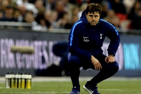 Tottenham Hotspur's manager Mauricio Pochettino watches his team during the English Premier League soccer match between Tottenham Hotspur and Newcastle United at Wembley Stadium, in London, England, Wednesday, May 9, 2018. (AP Photo/Alastair Grant)
