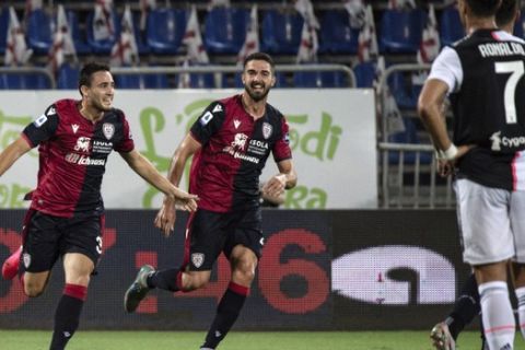 Cagliari's Luca Gagliano, left, celebrates after scoring during the Serie A soccer match between Cagliari and Juventus, at the Sardegna Arena stadium, in Cagliari, Italy, Wednesday, July 29, 2020. (Alessandro Tocco/Lapresse via AP)