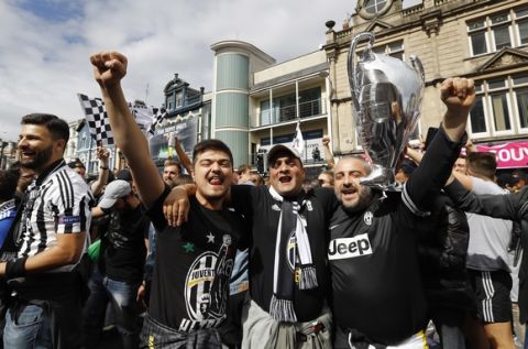 Juventus supporters react ahead of the Champions League final soccer match between Juventus and Real Madrid at the Millennium stadium in Cardiff, Wales Saturday June 3, 2017. (AP Photo/Frank Augstein)