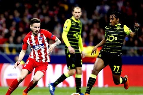 Atletico's Saul Niguez, left, vies for the ball with Sporting's Gelson Martins during the Europa League quarterfinal first leg soccer match between Atletico Madrid and Sporting CP at the Metropolitano stadium in Madrid, Thursday, April 5, 2018. (AP Photo/Francisco Seco)