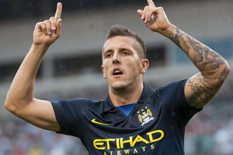 Manchester City forward Stevan Jovetic celebrates his goal early in the first half. 

 - AC Milan vs. Manchester City - Guinness International Champions Cup at Heinz Field, Pittsburgh - 27/07/2014 - Mandatory Credit: Pixel8 Photos/Jack Megaw - +44(0)7734 151429 - info@pixel8photos.com - NO UNPAID USE.