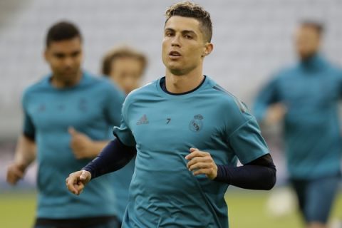 Real Madrid's Cristiano Ronaldo warms up during a training session in Munich, Germany, Tuesday, April 24, 2018. FC Bayern Munich will face Real Madrid for a Champions League semi final first leg soccer match in Munich on Wednesday, April 25, 2018. (AP Photo/Matthias Schrader)