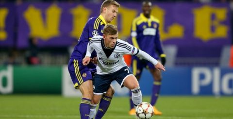 MARIBOR, SLOVENIA - DECEMBER 10:  Max Meyer (R) of Schalke battles for the ball with Ales Mertelj of Maribor during the UEFA Group G Champions League match between NK Maribor and FC Schalke 04 at Ljudski vrt Stadium on December 10, 2014 in Maribor, Slovenia.  (Photo by Alexander Hassenstein/Bongarts/Getty Images)