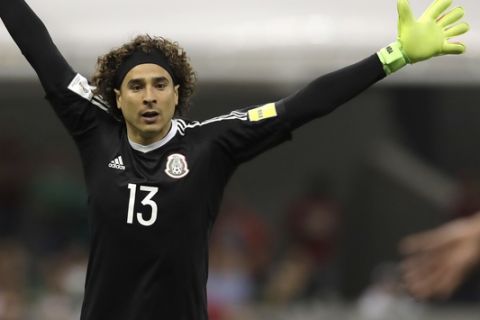 Mexico goalkeeper Guillermo Ochoa spreads his arms during a 2018 Russia World Cup qualifying soccer match between Mexico and Costa Rica at Azteca Stadium in Mexico City, Friday, March 24, 2017. (AP Photo/Rebecca Blackwell)