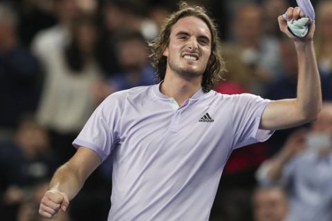 Stefanos Tsitsipas of Greece celebrates winning the men's singles final of the Open 13 Provence tennis tournament against Felix Auger-Aliassime of Canada in two sets, 6-3, 6-4, in Marseille, southern France, Sunday, Feb. 23, 2020. (AP Photo/Daniel Cole)