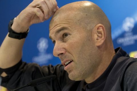 Real Madrid's head coach Zinedine Zidane ponders a question during a press conference at a media open day in Madrid, Tuesday May 30, 2017. Real Madrid play Juventus Saturday in the Champions League final in Cardiff. (AP Photo/Paul White)