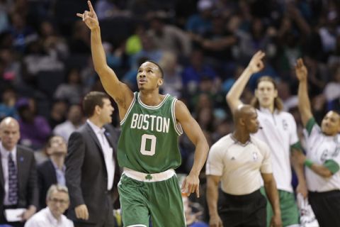 Boston Celtics' Avery Bradley (0) celebrates after making a three point basket against the Charlotte Hornets during the second half of an NBA basketball game in Charlotte, N.C., Monday, March 30, 2015. The Celtics won 116-104. (AP Photo/Chuck Burton)
