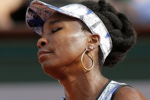 Venus Williams of the U.S. closes her eyes after missing a shot against Timea Bacsinszky of Switzerland during their fourth round match of the French Open tennis tournament at the Roland Garros stadium, in Paris, France. Sunday, June 4, 2017. (AP Photo/Michel Euler)