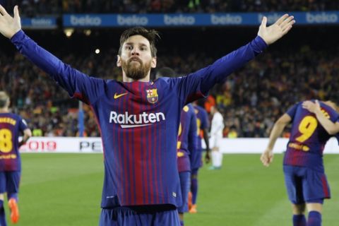 Barcelona's Lionel Messi greets fans after scoring his side's second goal during a Spanish La Liga soccer match between Barcelona and Real Madrid, dubbed 'El Clasico', at the Camp Nou stadium in Barcelona, Spain, Sunday, May 6, 2018. (AP Photo/Emilio Morenatti)