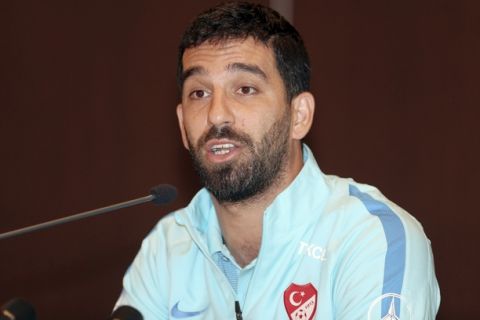 Barcelona midfielder Arda Turan announces during a short press conference in Portoroz, Slovenia, Tuesday, June 6, 2017, that he is ending his Turkey International career after he was dropped from the country's national team after reportedly attacking a sports journalist aboard a team plane. Turkey coach Fatih Terim ousted Turan from the national squad and also kicked him out of a training camp in Slovenia ahead of a World Cup qualifier against Kosovo on Sunday, Turkish media reports said.(AP Photo)
